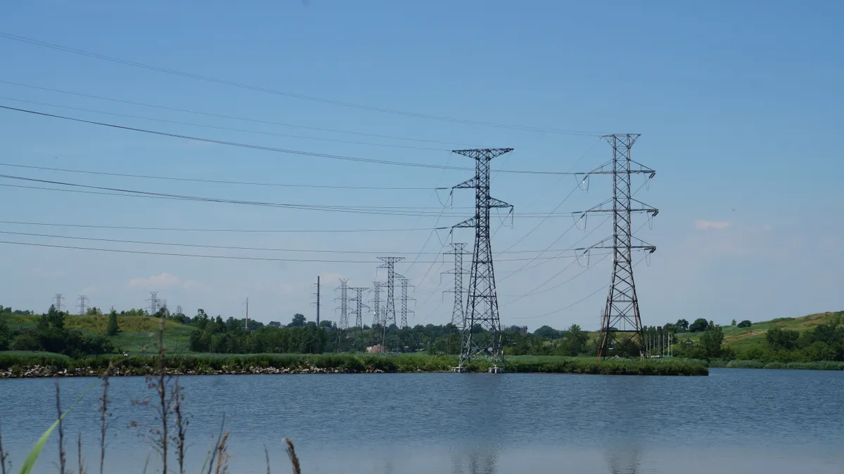 Power lines near marshlands.