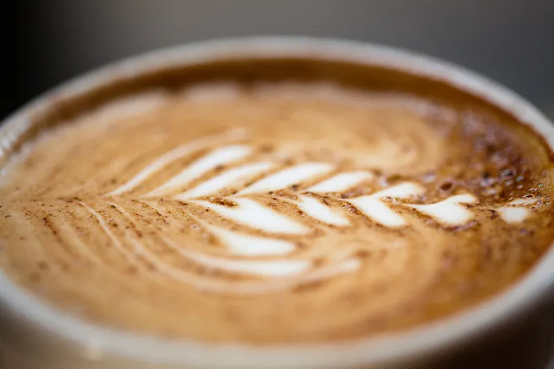 A close-up photo of the top of a cup of coffee