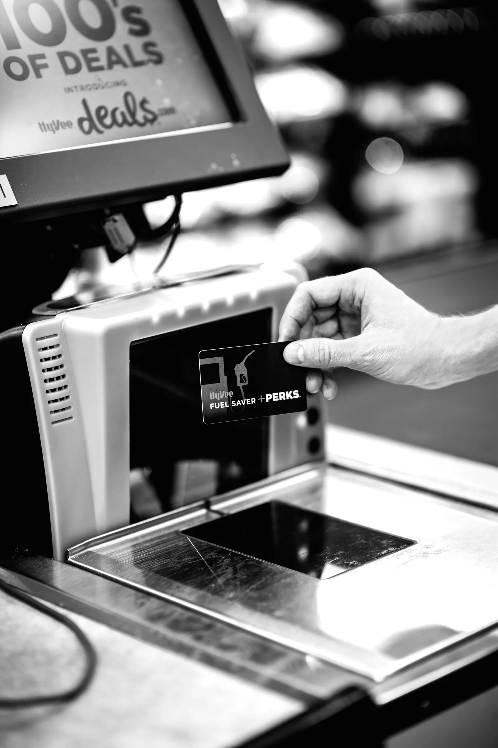 A photo of a Fuel Saver + Perks card being scanned at a checkout.