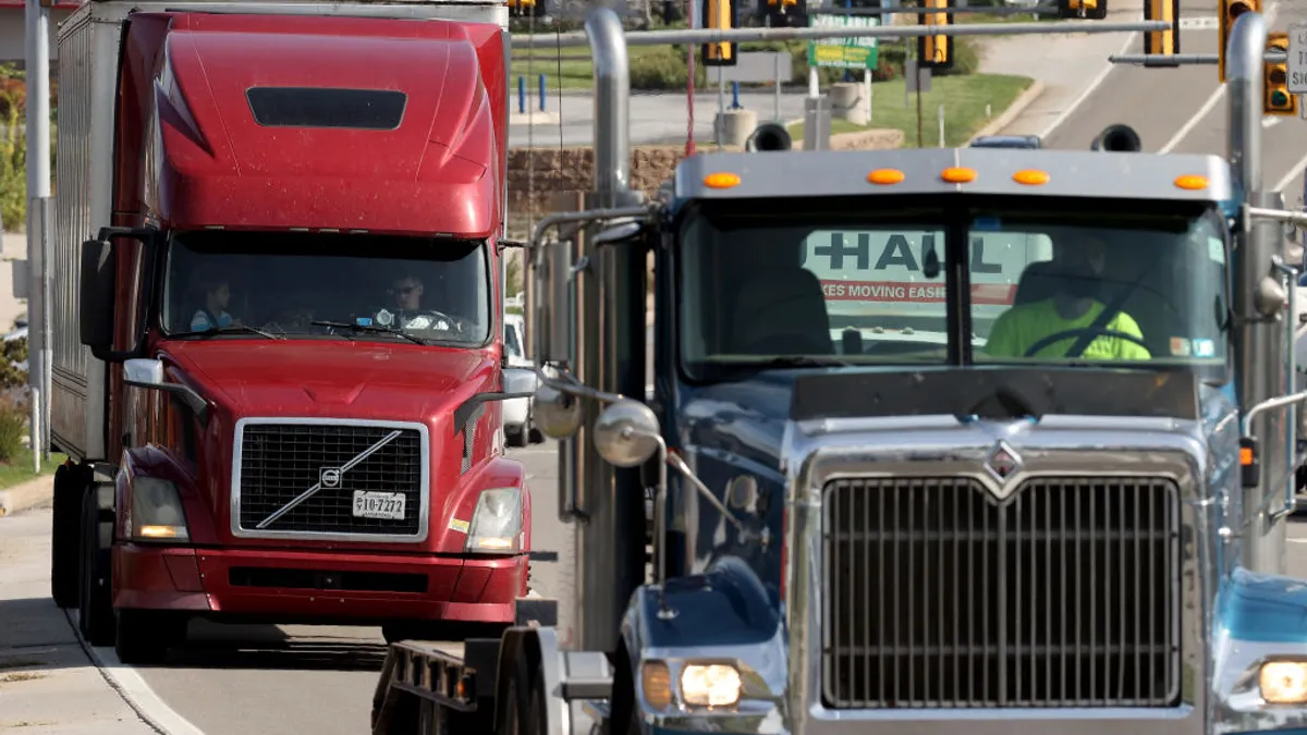 Trucks on the road by intersections near an interchange with the Pennsylvania Turnpike