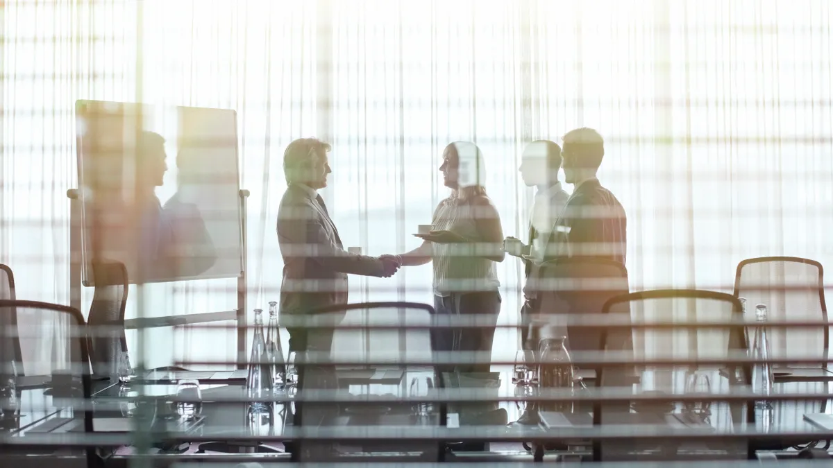 A group of people shaking hands