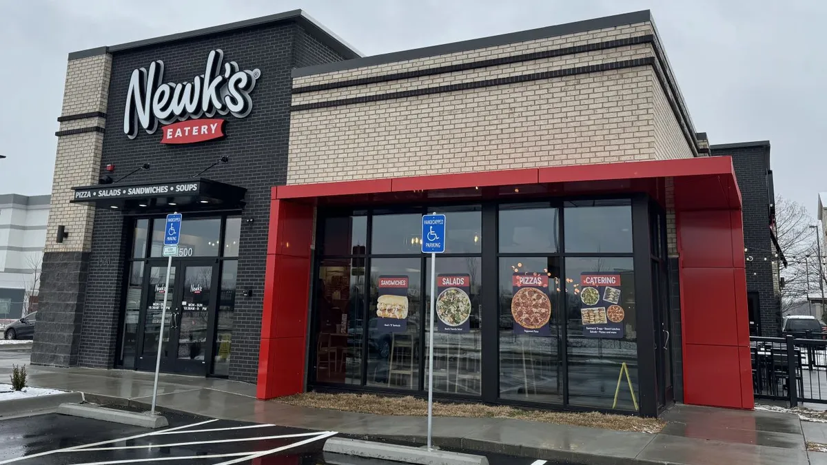 An image of a black building with a red sign that says "Newk's."