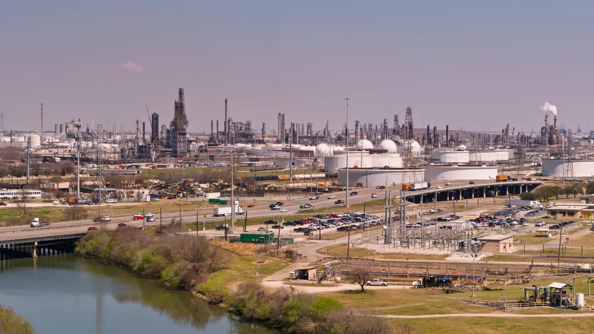 Static Drone Shot of Freeway Passing Industrial Facilities in Houston, Texas