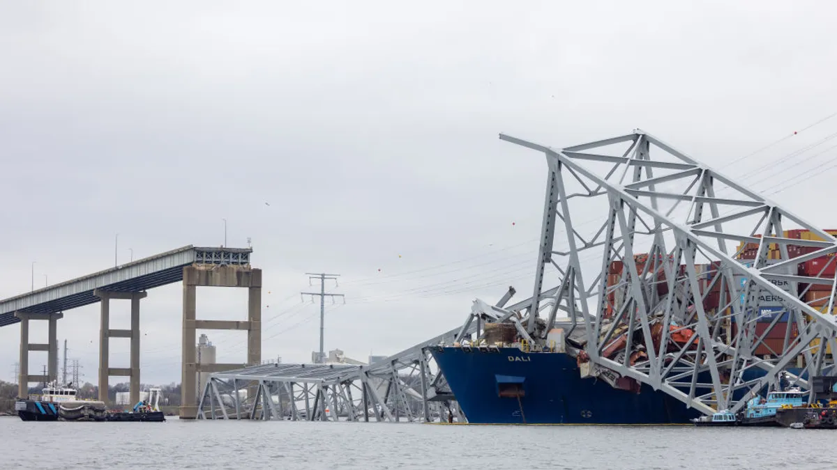 Wreckage from the collapsed Francis Scott Key Bridge rests on the cargo ship Dali.