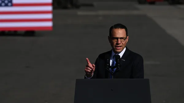 Pennsylvania Gov. Josh Shapiro speaks at a podium.