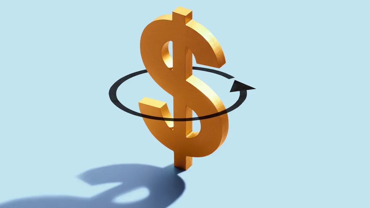 A gold dollar symbol is circled by an arrow on a blue background in a concept that illustrates cash flow.