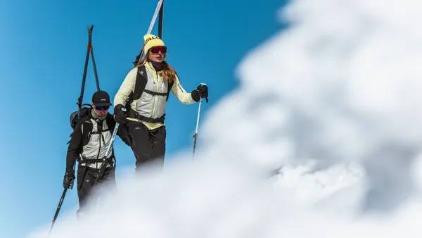 Two people hiking in the snow.