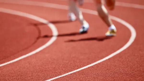 Shot of runners on a racetrack