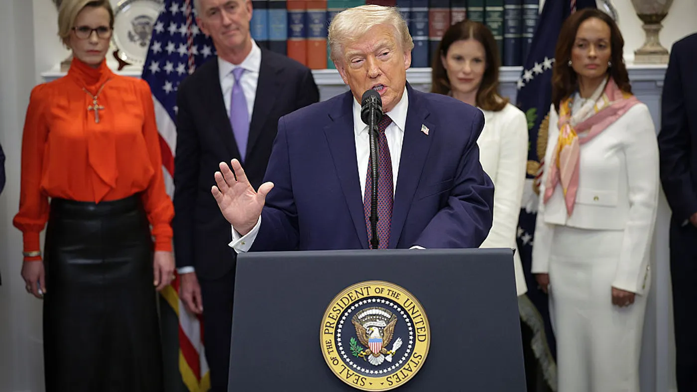 A photo of President Trump at the White House in front of several pharmaceutical executives