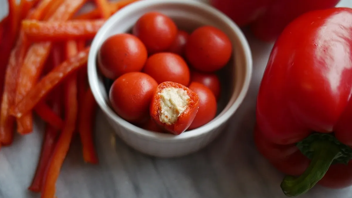 Roasted red pepper "berries" filled with hummus, made through Foodberry's technology.