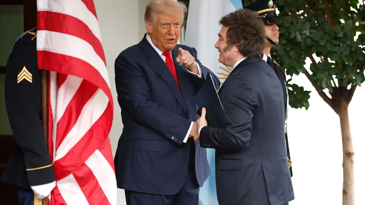 U.S. President Donald Trump shakes hands with Argentina President Javier Milei at the White House on Oct. 14, 2025, in Washington, D.C.