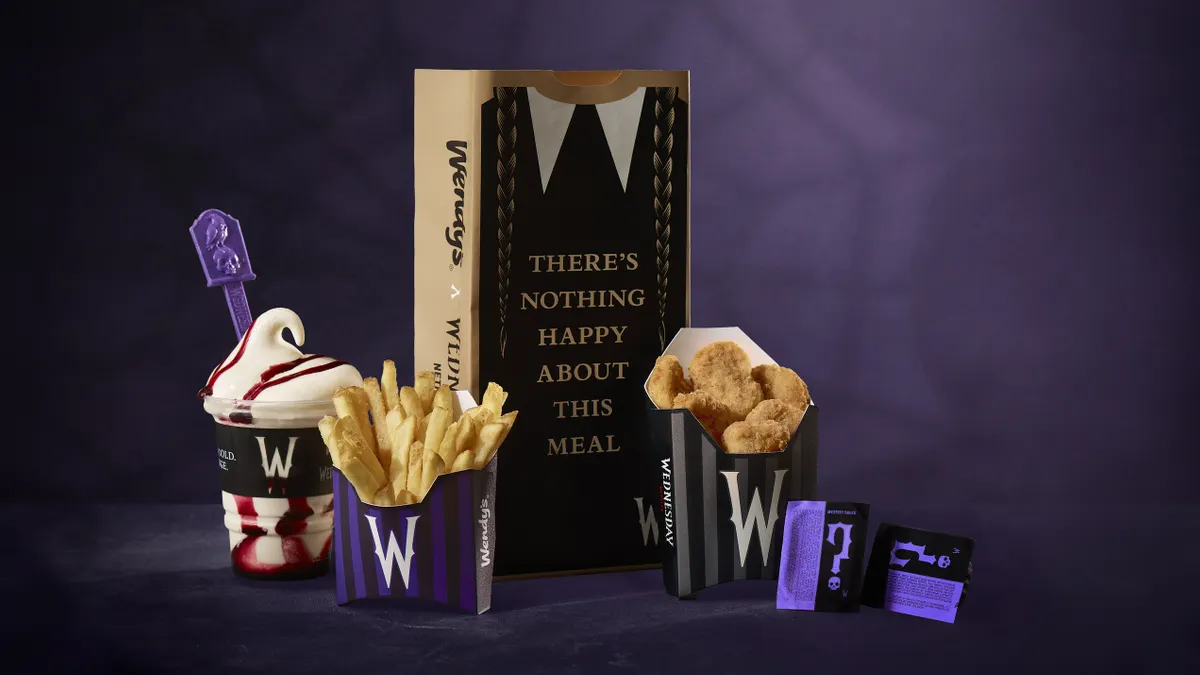 Wendy's Meal of Misfortune collaboration with "Wednesday" is displayed against a purple backdrop