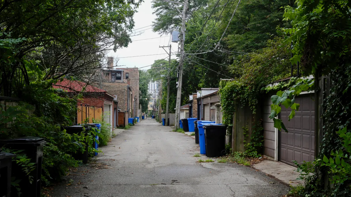 Alley in Chicago's Hyde Park with waste and recycling carts