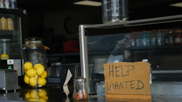 A help wanted sign is displayed at a boardwalk restaurant the day before the Memorial Day weekend, the unofficial start of summer, in the shore community of Wildwood on May 28, 2021 in Wildwood, New J