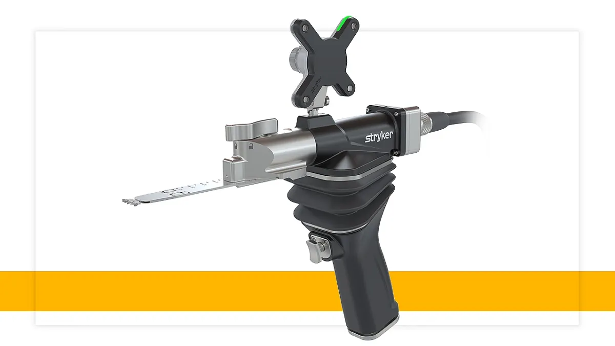 A handheld tool with a metal protrusion says "Stryker" on the side.