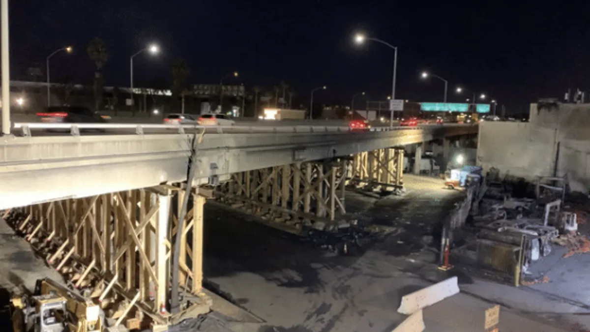 A video still shows traffic flowing on I-10 in Los Angeles Sunday. Workers shored up fire-damaged columns to allow the reopening.