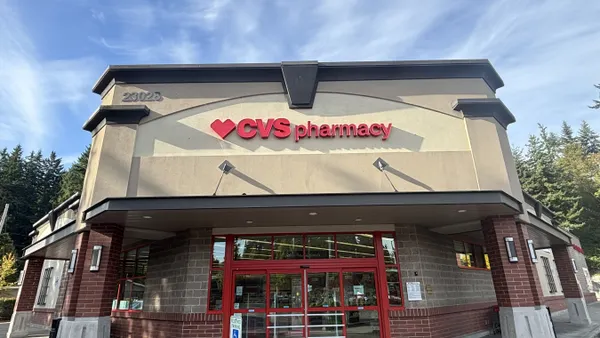 A beige storefront with a red CVS Pharmacy sign.