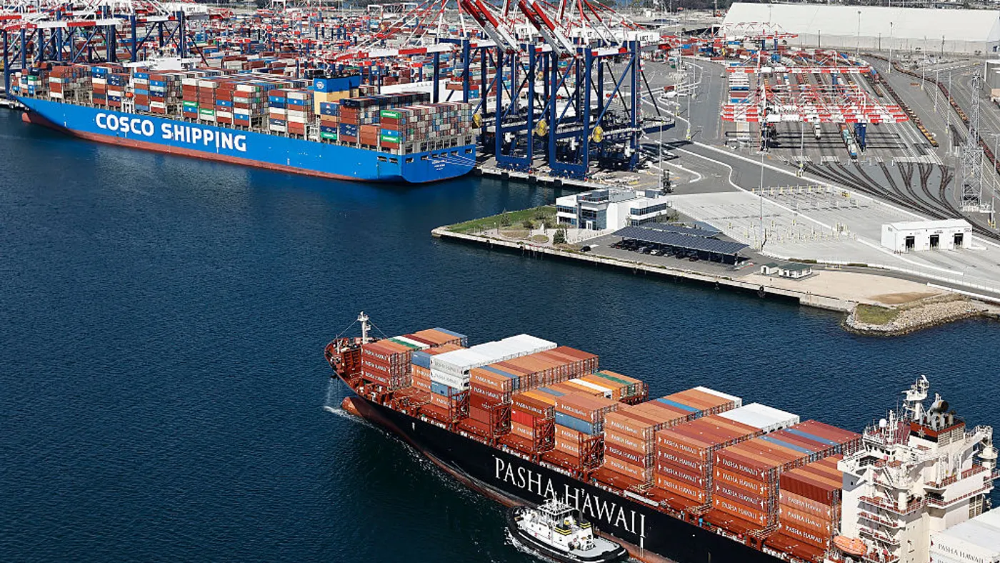An aerial view of a Pasha Hawaii container ship arriving in the Port Of Long Beach near a Cosco Shipping container ship on April 3, 2025 in Long Beach, California.