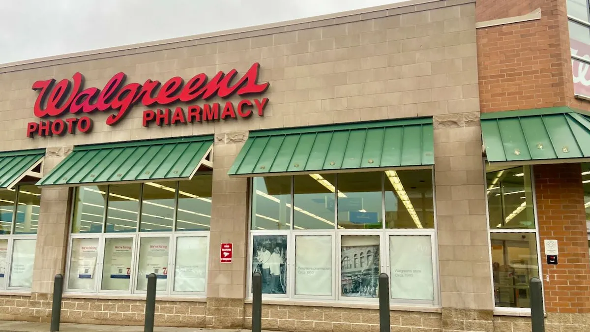 A Walgreens drugstore with green awnings.