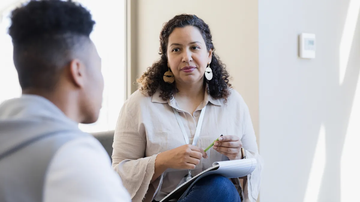 A psychotherapist speaking with a patient