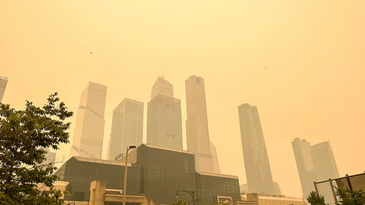 Smoke from the Canadian wildfires blots out the un over Midtown Manhattan.