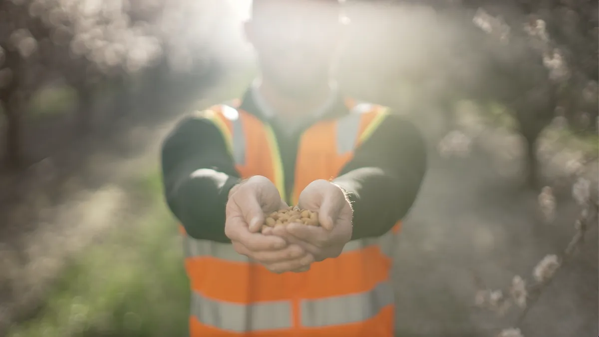 Campaign images for Kind Snacks' Almond Acres initiative and pilot program.