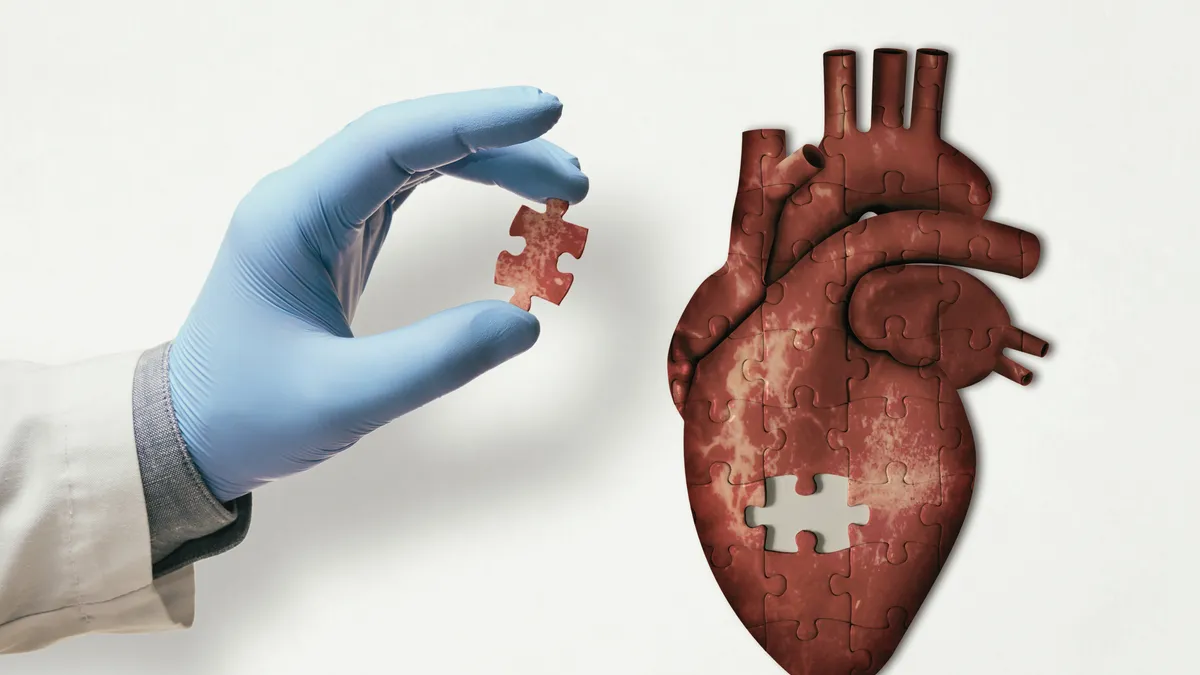 Puzzle of the human heart and doctor hand with the missing piece of puzzle