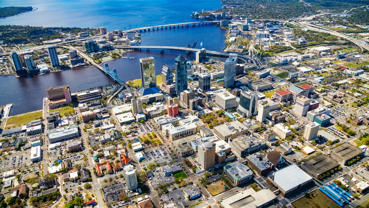 An aerial view of a downtown area of a city on the water.