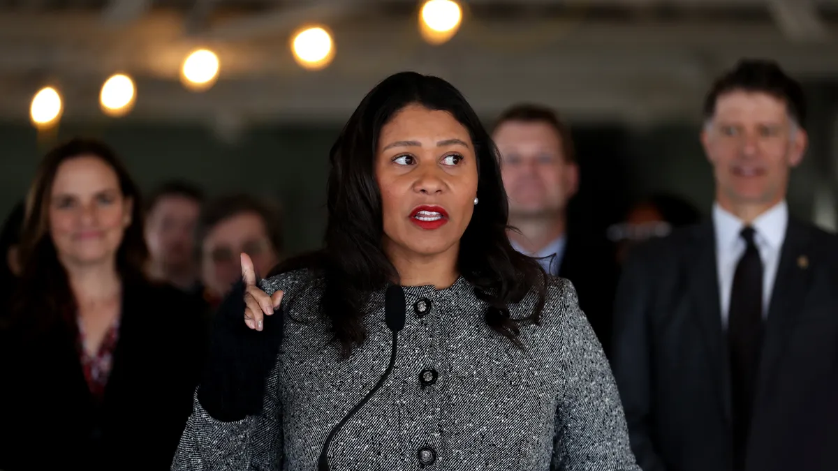 San Francisco Mayor London Breed speaks at a podium.