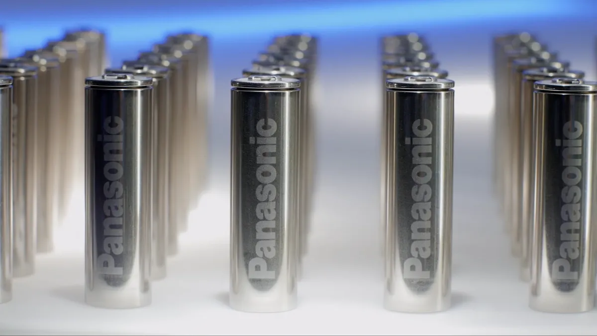 Rows of silver batteries on a flat surface.