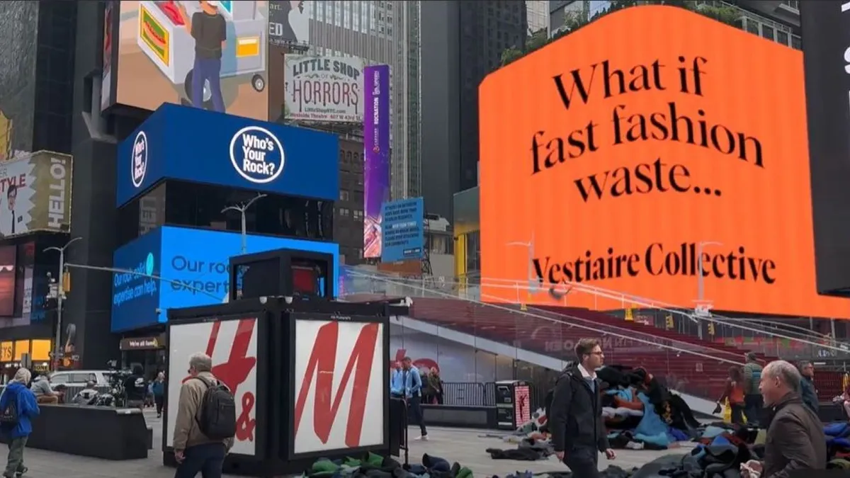 An AI generated version of Times Square depicting piles of clothing on the street and a sign reading "what if fast fashion waste"