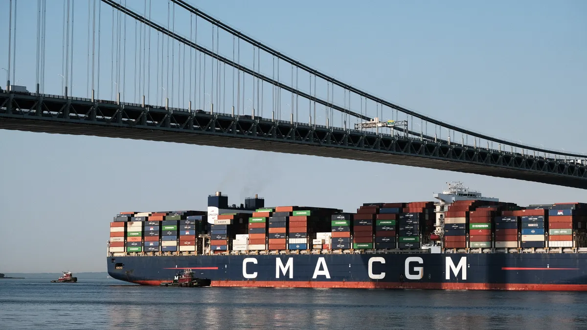 The Marco Polo, the largest cargo ship to call at an East Coast port, arrives under the Verrazzano-Narrows Bridge and into New York Harbor on May 20, 2021