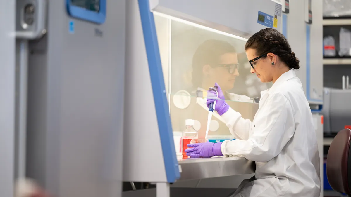 A person works in Sionna Therapeutics' lab.