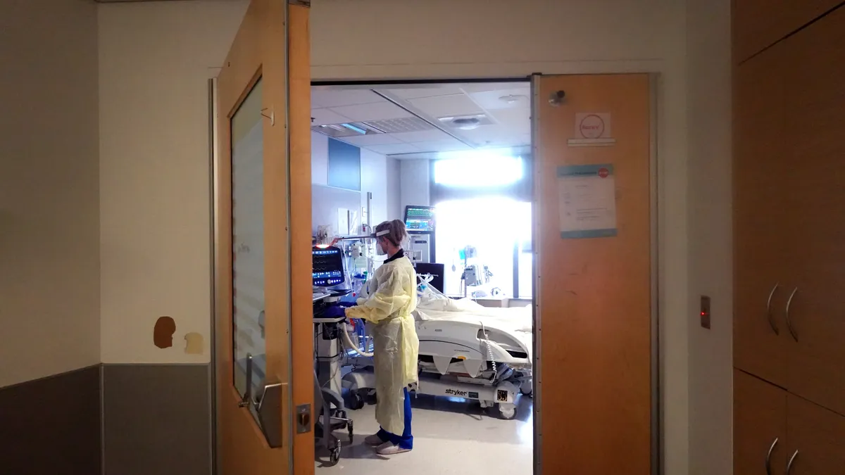 A respiratory therapist checks on a patient at a medical center in Chicago, Illinois.