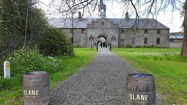 The entry way to the Slane Irish Whiskey Distillery, with barrels on either side.