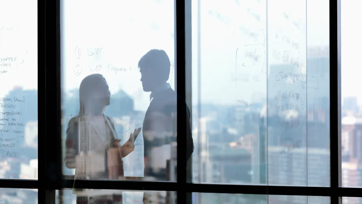 Silhouette shadows of business people talking in office