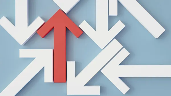 One red arrow points up amid a sea of white arrows pointing in other directions