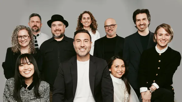 A group of executives at Tamara Group pose for a photo