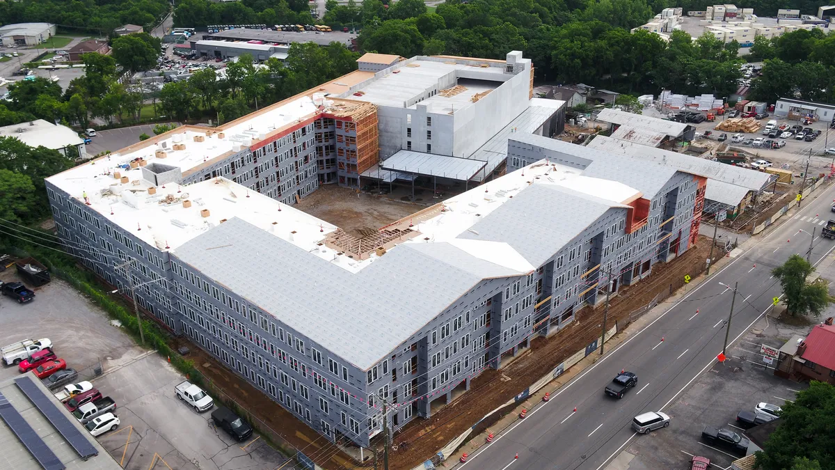 An apartment complex under construction seen from above.