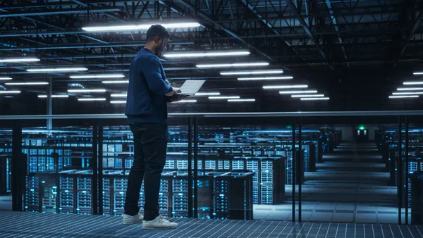 a tech worker in a large server room