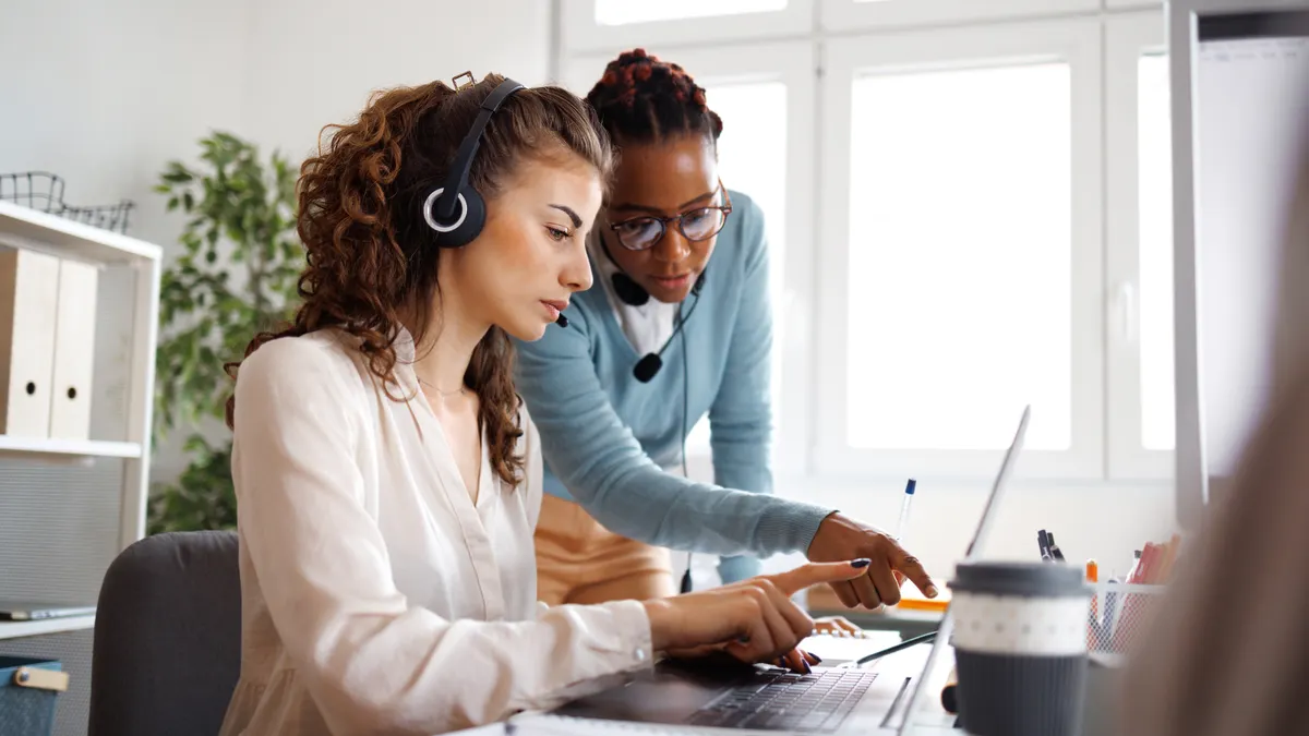 Female coworkers working together in small offfice