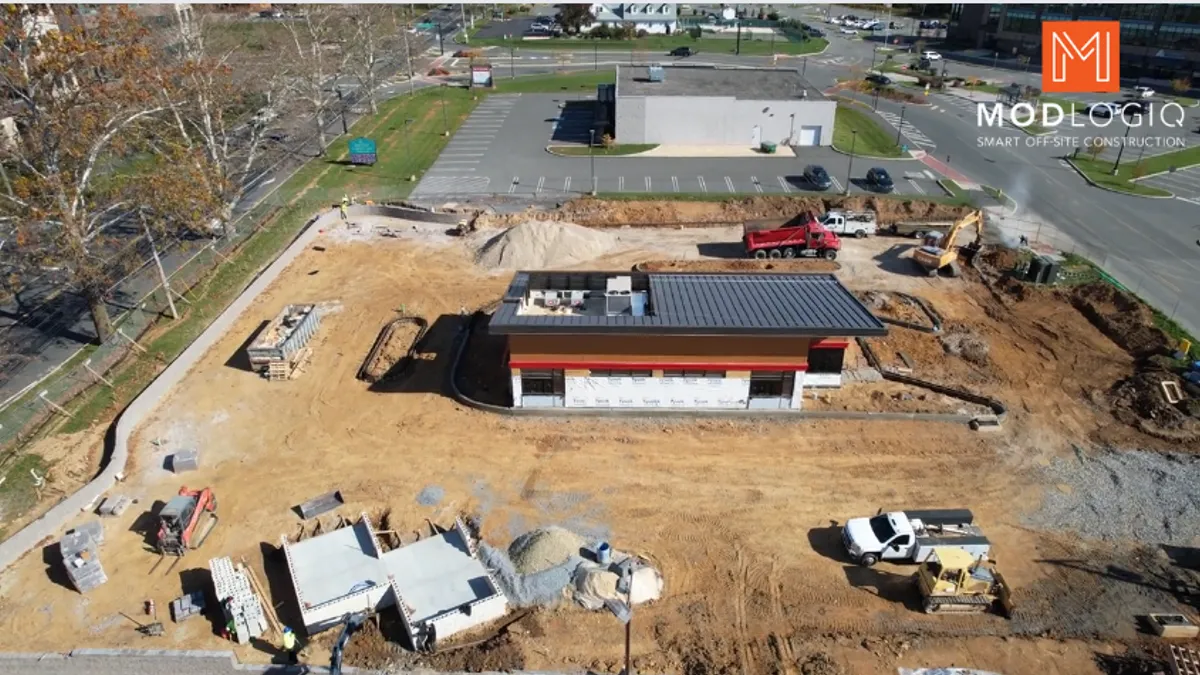 A photo of a prefabricated Wawa drive-thru being assembled on site.