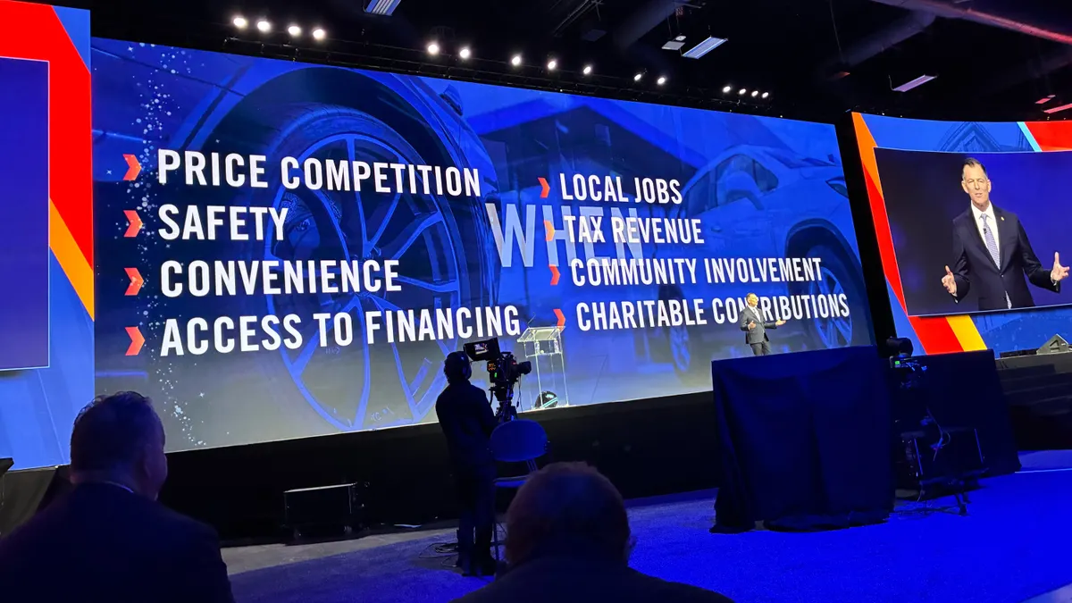 Mike Stanton enumerates the virtues of dealer sales versus direct to consumer sales on stage at NADA Show 2026 in Las Vegas.