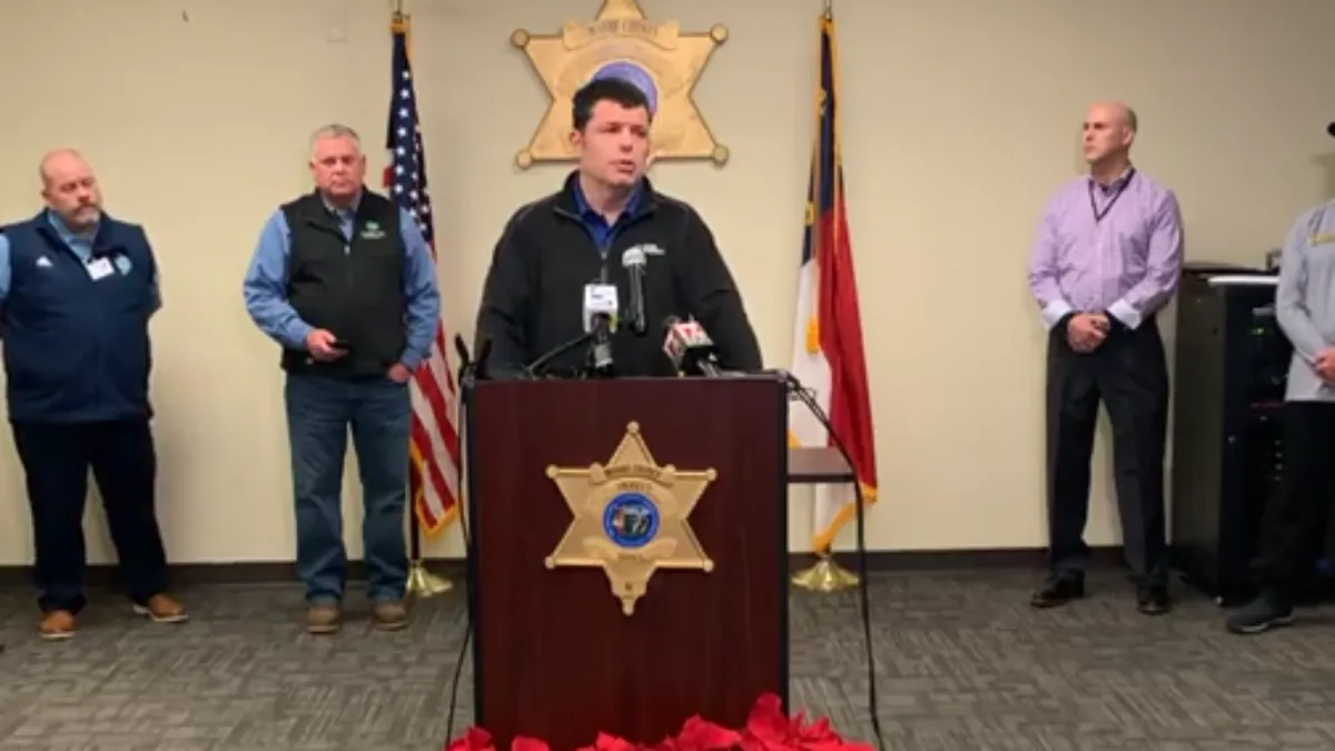 Duke Energy spokesperson Jeff Brooks appears at a press conference to update Moore County residents on recovery efforts following a weekend attack on two North Carolina substations.