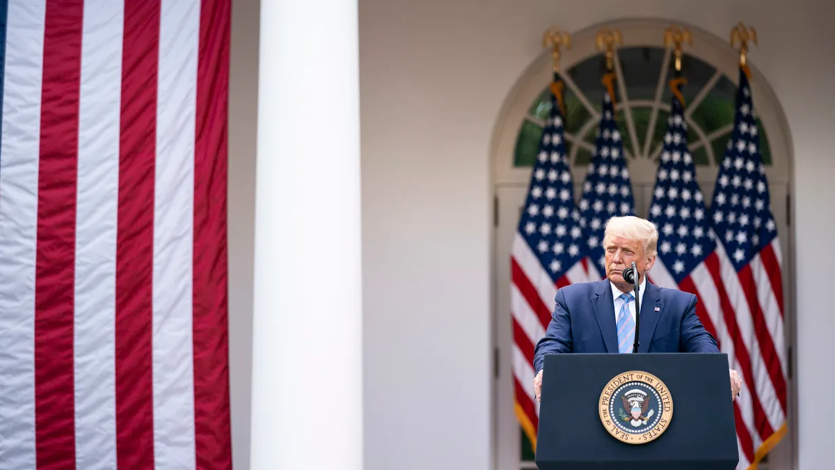 President Donald J. Trump listens as Vice President Mike Pence addresses his remarks during an update on the nation’s COVID-19 Coronavirus testing strategy Monday, Sept. 28, 2020, in the Rose Garden o