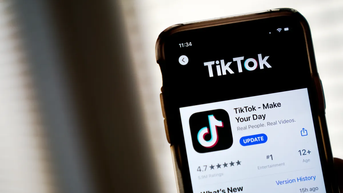 A phone screen displays a window for downloading TikTok.