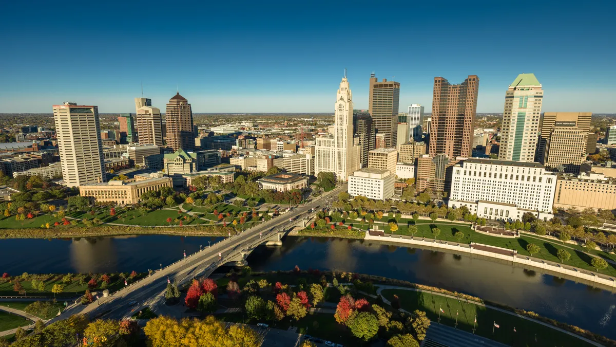 The Columbus, Ohio skyline is shown, with the river in the foreground