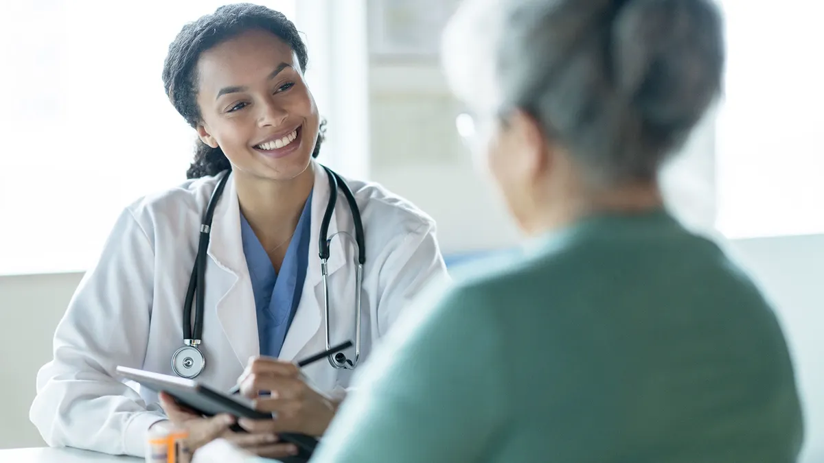 Nurse smiling at patient