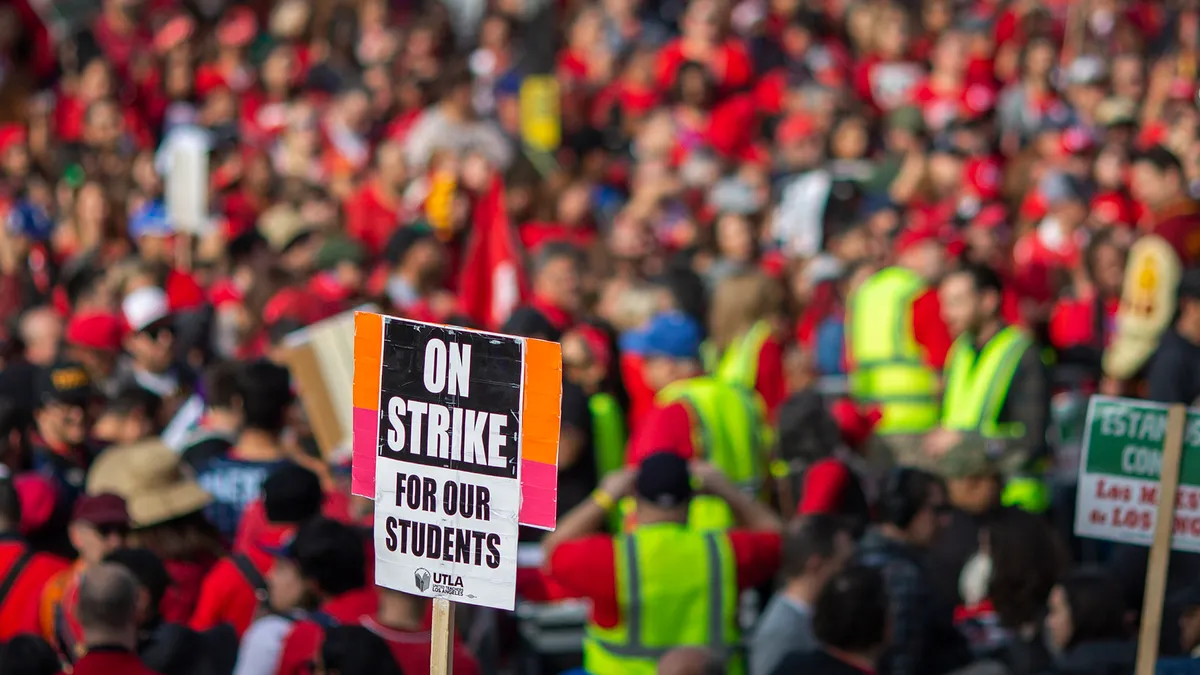 A large crowd of striking teachers and supporters rally outside City Hall in Los Angeles, California.