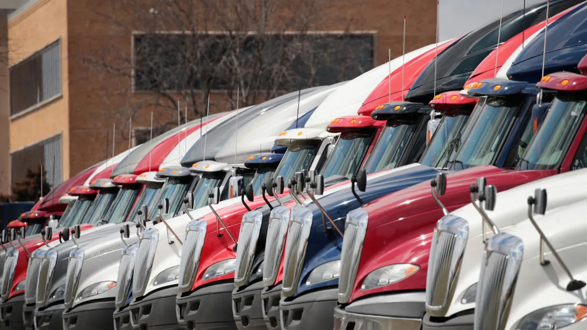 A row of International trucks parked outside a Navistar facility in 2018.